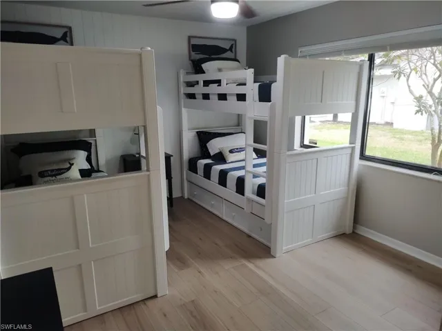 Bedroom featuring light wood-style floors and ceiling fan