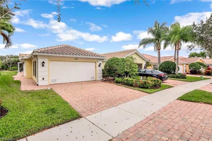 Fabulous curb appeal, complete with brick paver driveway and walkway