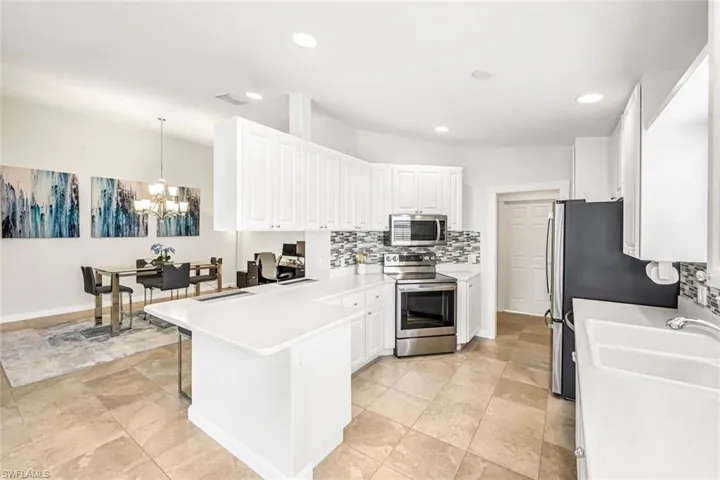 Stainless Steel appliances with ample counter-space and storage