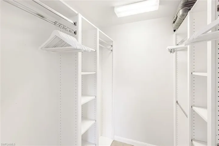 Custom Built-in organizing system in the Primary Closet