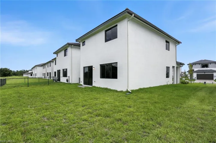 Back of property with stucco siding