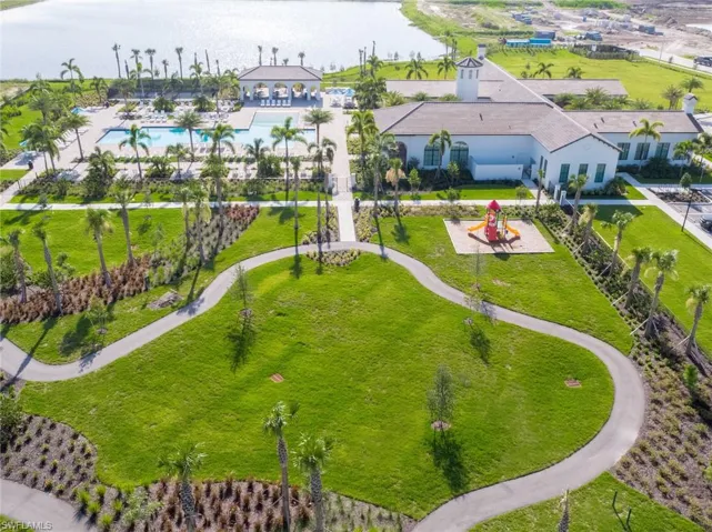 Bird's eye view of a pool and a nearby body of water