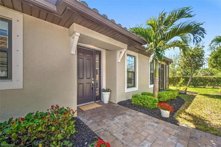 View of exterior entry with stucco siding