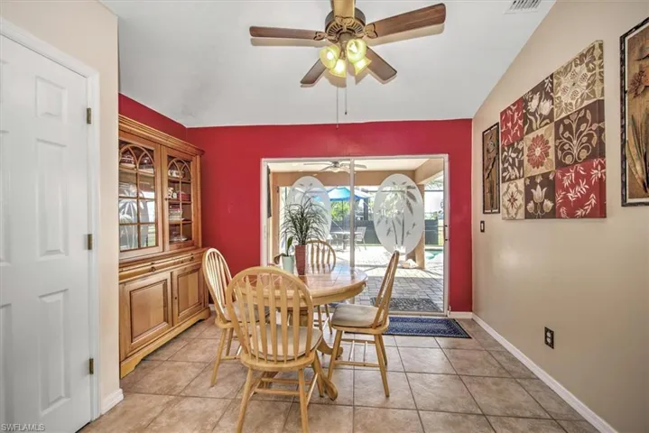 Dining space featuring ceiling fan and light tile patterned floors