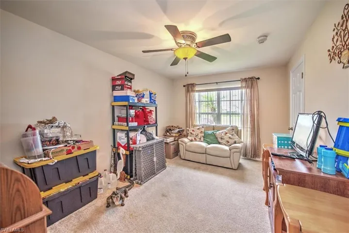 Playroom with carpet flooring and ceiling fan