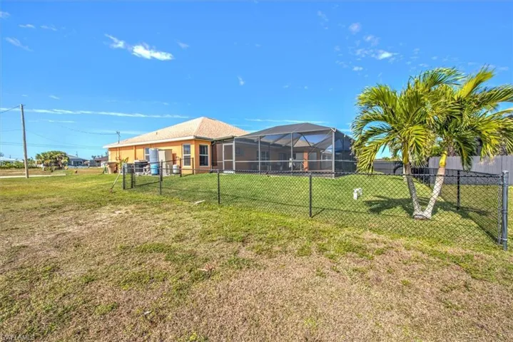 View of yard featuring a lanai