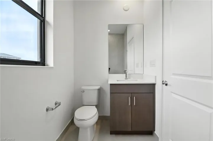 Bathroom with vanity and toilet