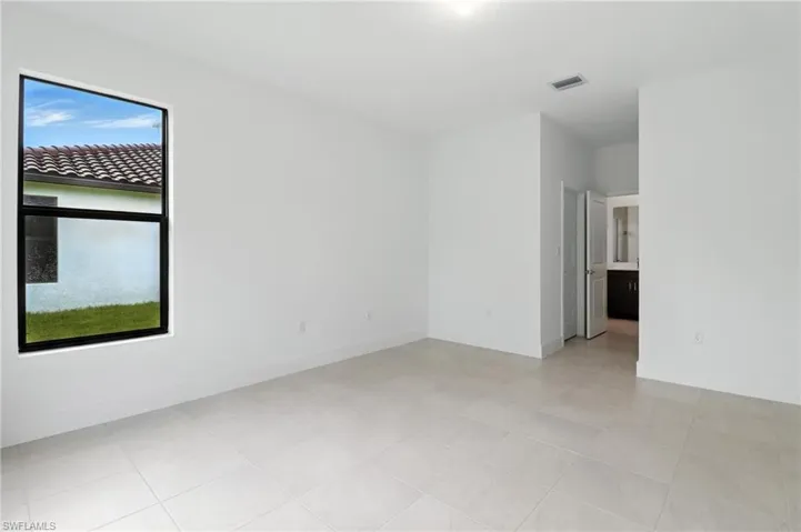 Empty room featuring baseboards