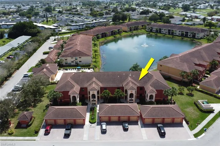 Aerial view of residential area featuring a large body of water