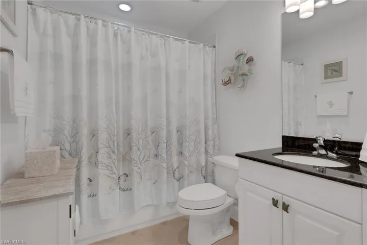 Full bathroom featuring vanity and shower / tub combo