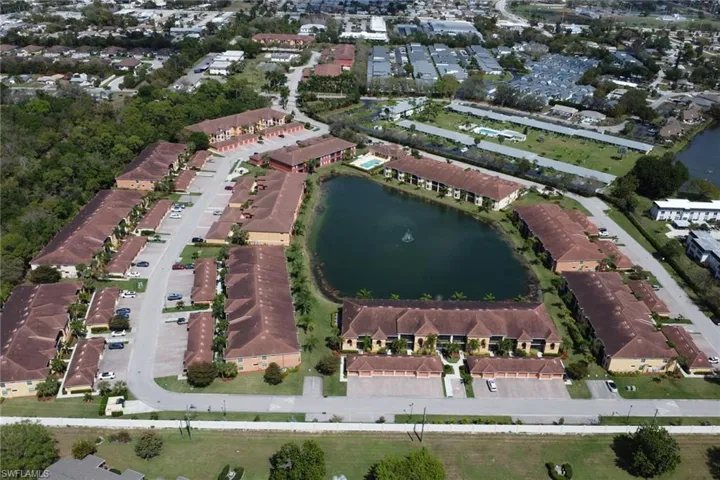 View of property location with nearby suburban area and a large body of water
