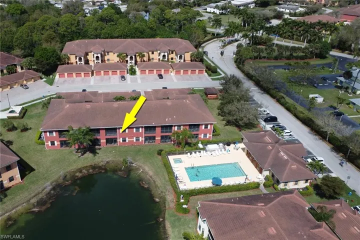 View of property location with a large body of water and a pool area