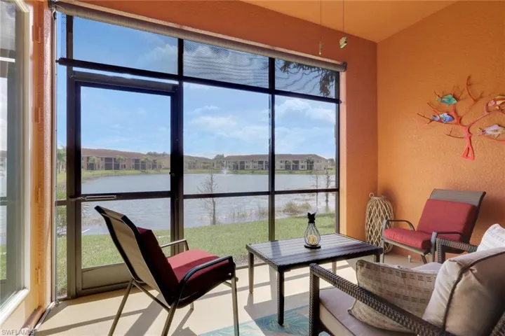 Sunroom with a water view