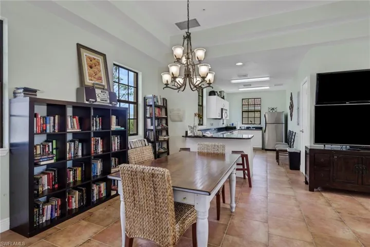 Dining room featuring a chandelier and light tile patterned floors