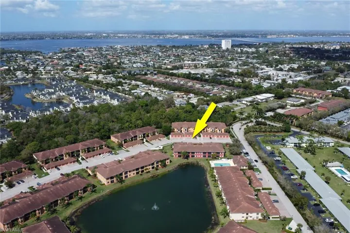 Aerial overview of property's location with a large body of water