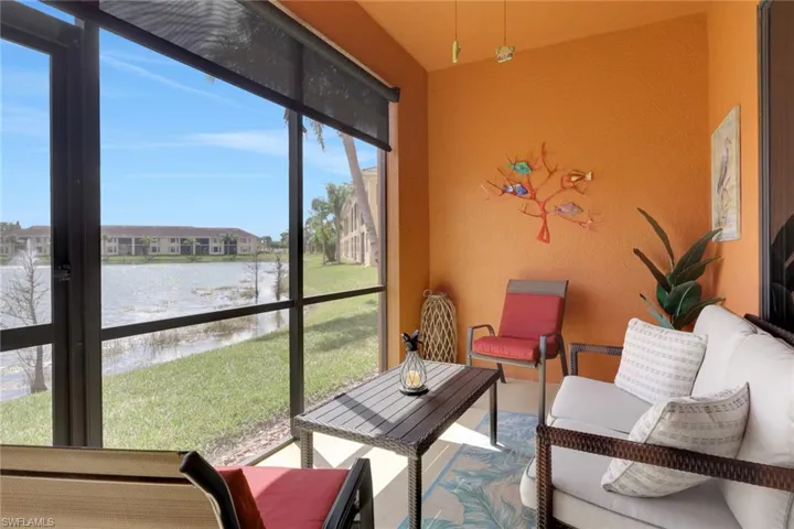 Sunroom with a water view
