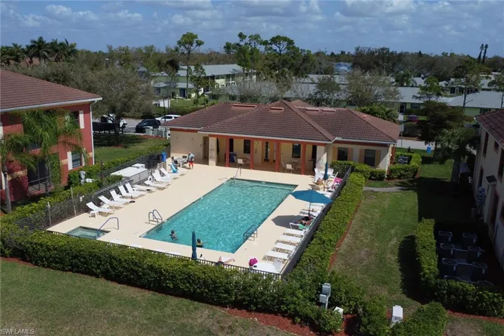 Community pool featuring a patio and a residential view