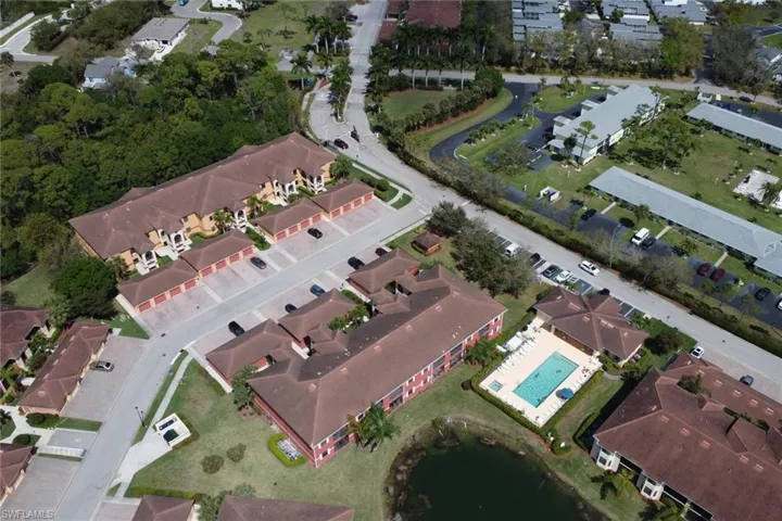 Aerial view of property's location with nearby suburban area