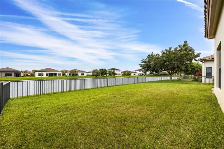 Fenced backyard with a residential view