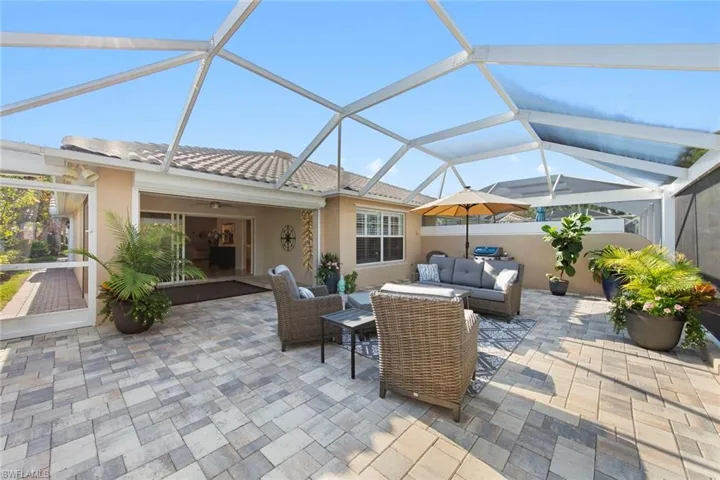 View of patio / terrace with glass enclosure and outdoor lounge area
