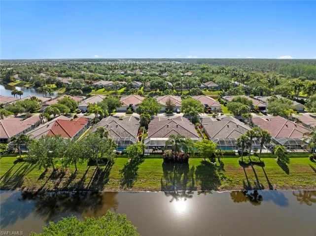 Drone / aerial view featuring a water view and a residential view