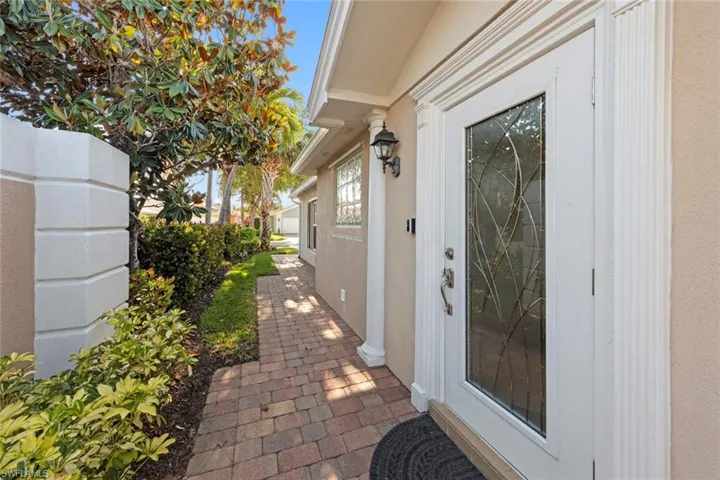 View of exterior entry with stucco siding
