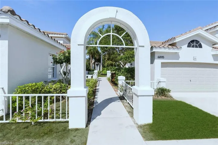 View of home's community featuring concrete driveway