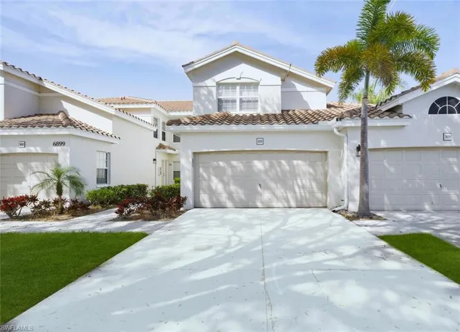 Mediterranean / spanish-style house featuring stucco siding, driveway, a garage, and a tile roof