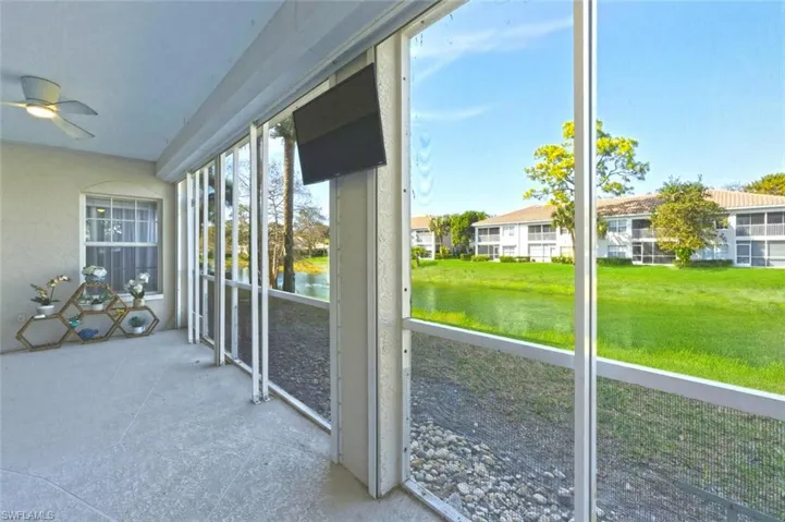 Unfurnished sunroom with ceiling fan
