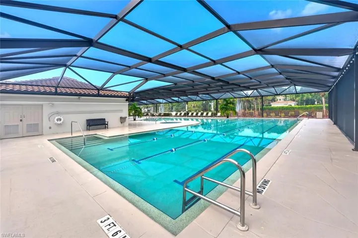 Community pool with a patio and a lanai