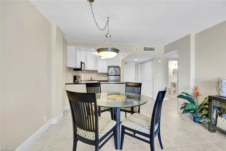 Dining area featuring baseboards and light tile patterned floors