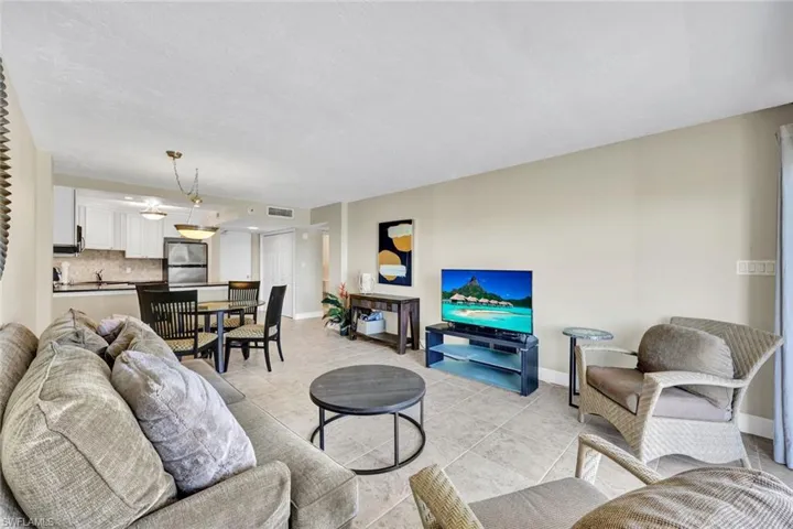 Living area with baseboards and light tile patterned floors