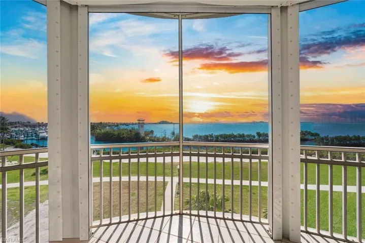 Unfurnished sunroom featuring a water view