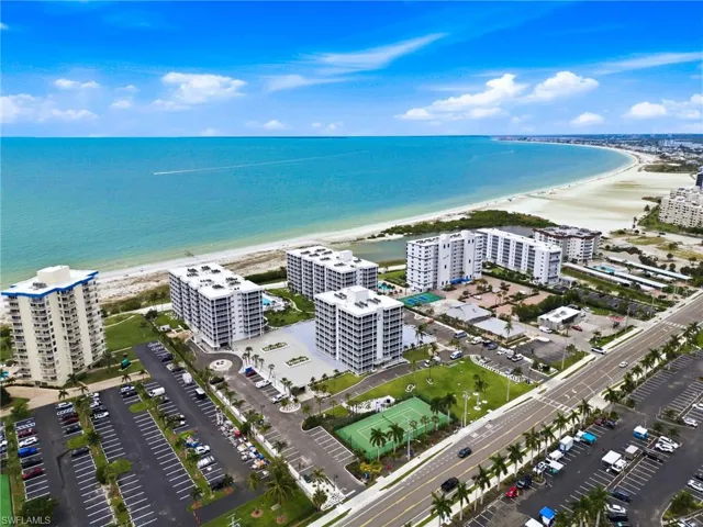 Expansive coastline with sandy beach and clear blue water
