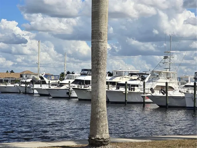 Dock area featuring a view of the boats and water !