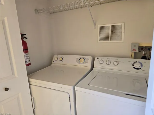 Laundry area featuring washing machine and dryer