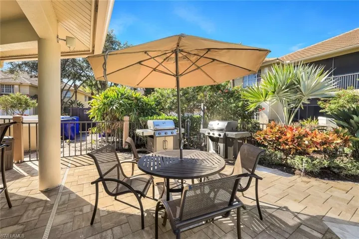 View of patio / terrace featuring outdoor dining space and a grill