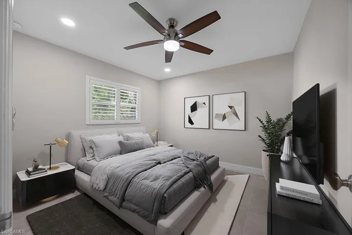 Bedroom with recessed lighting and ceiling fan