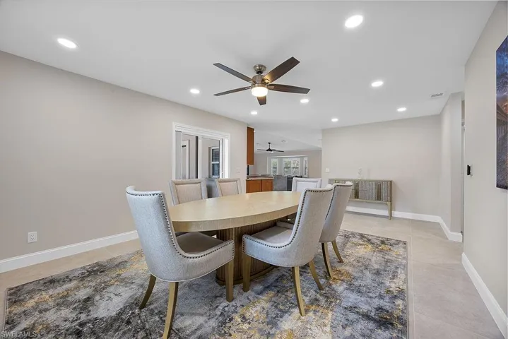 Dining space featuring ceiling fan, recessed lighting, and light tile patterned floors