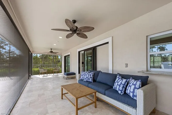 Screen in lanai featuring stone finish flooring and recessed lighting