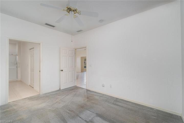 Primary bedroom with pocket door to bathroom