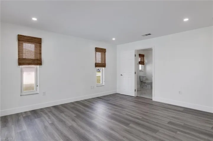 Primary bedroom with ample natural light with a primary bathroom.