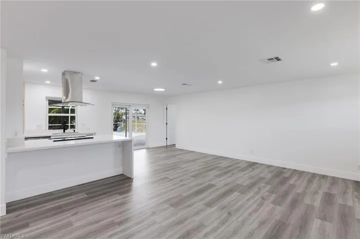 Living room featuring light hardwood / wood-style vinyl flooring
