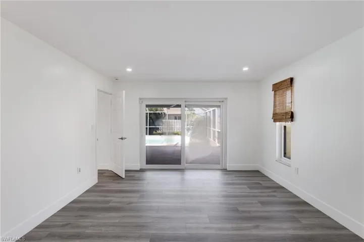 Primary bedroom with direct access to Lanai and pool through sliding door