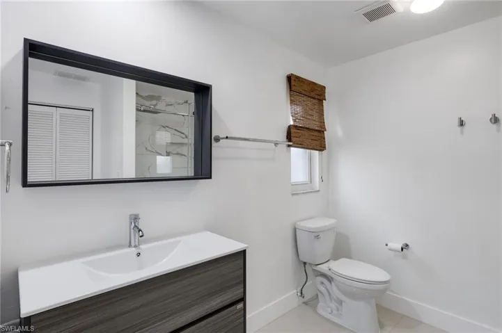 Primary bathroom featuring vanity and toilet