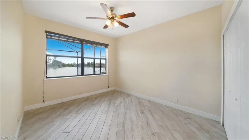 2nd bedroom overlooking the pool and lake.