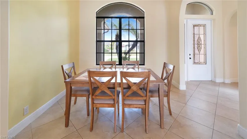 Formal dining room and foyer with lots of natural light.