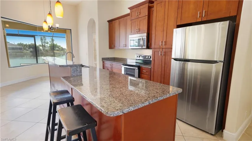 Your kitchen made for entertaining. Look at that view through the picture window in the breakfast nook looking out on the sparkling lake.
