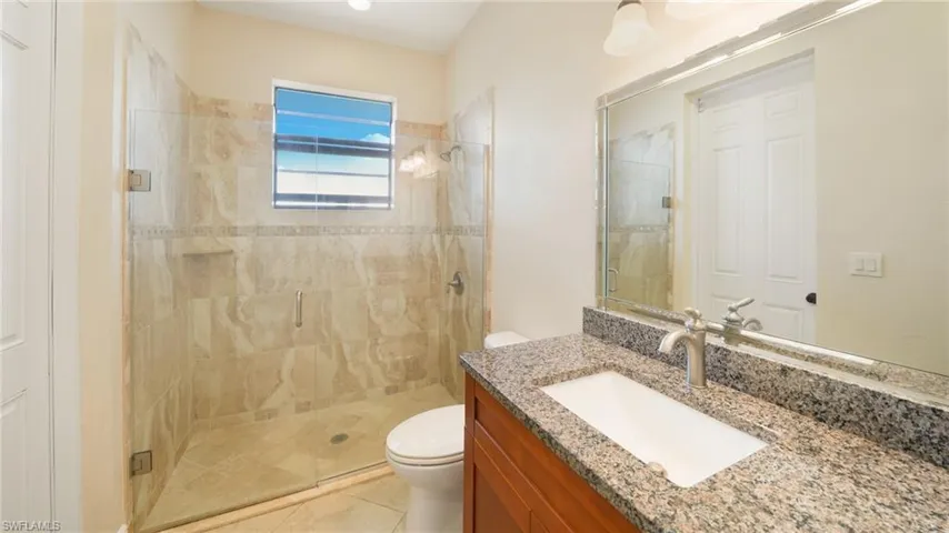 Pool bath with tiled shower.