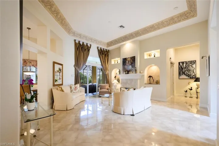 Primary Bedroom is located off the Formal Living Room with Gorgeous Art Work at the Entry